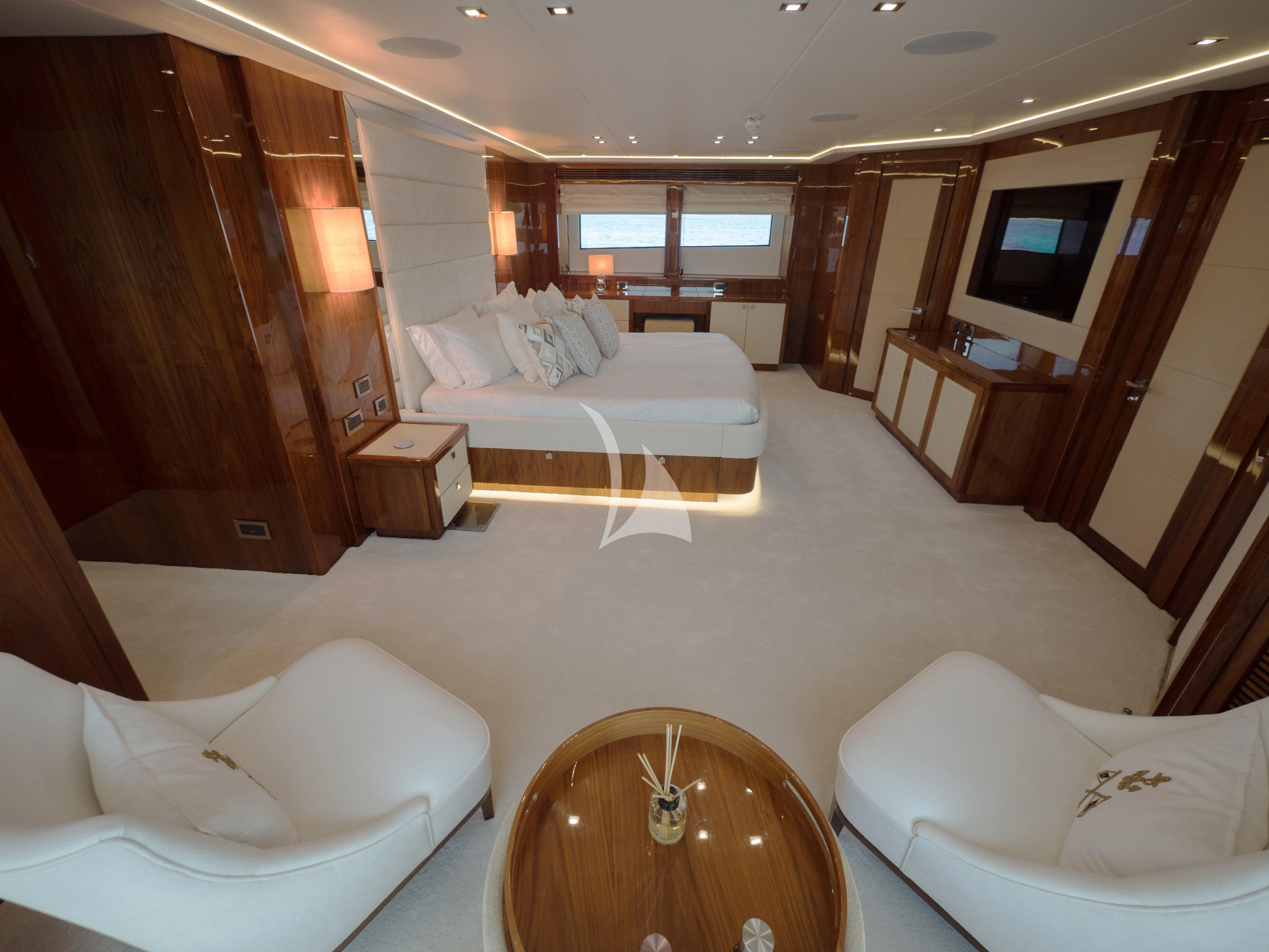 a hotel room with a bed and a television aboard ANYA Yacht for Sale