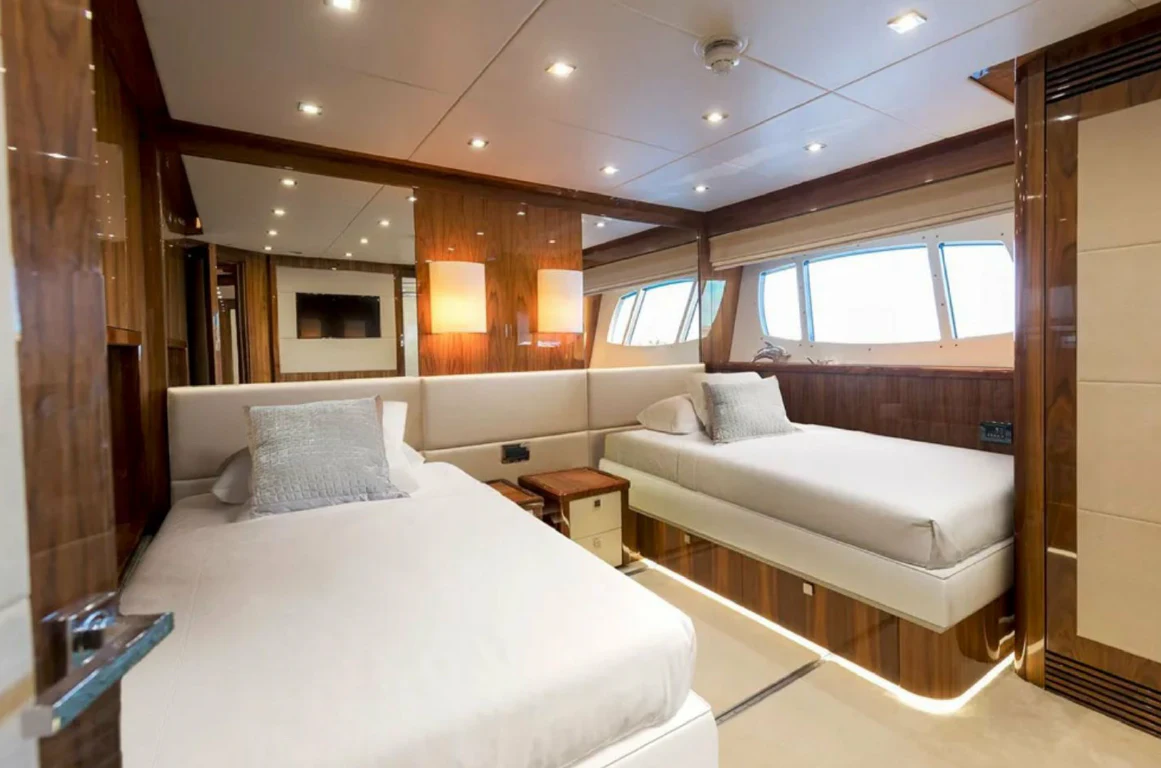 a room with a bed and a window aboard ANYA Yacht for Sale