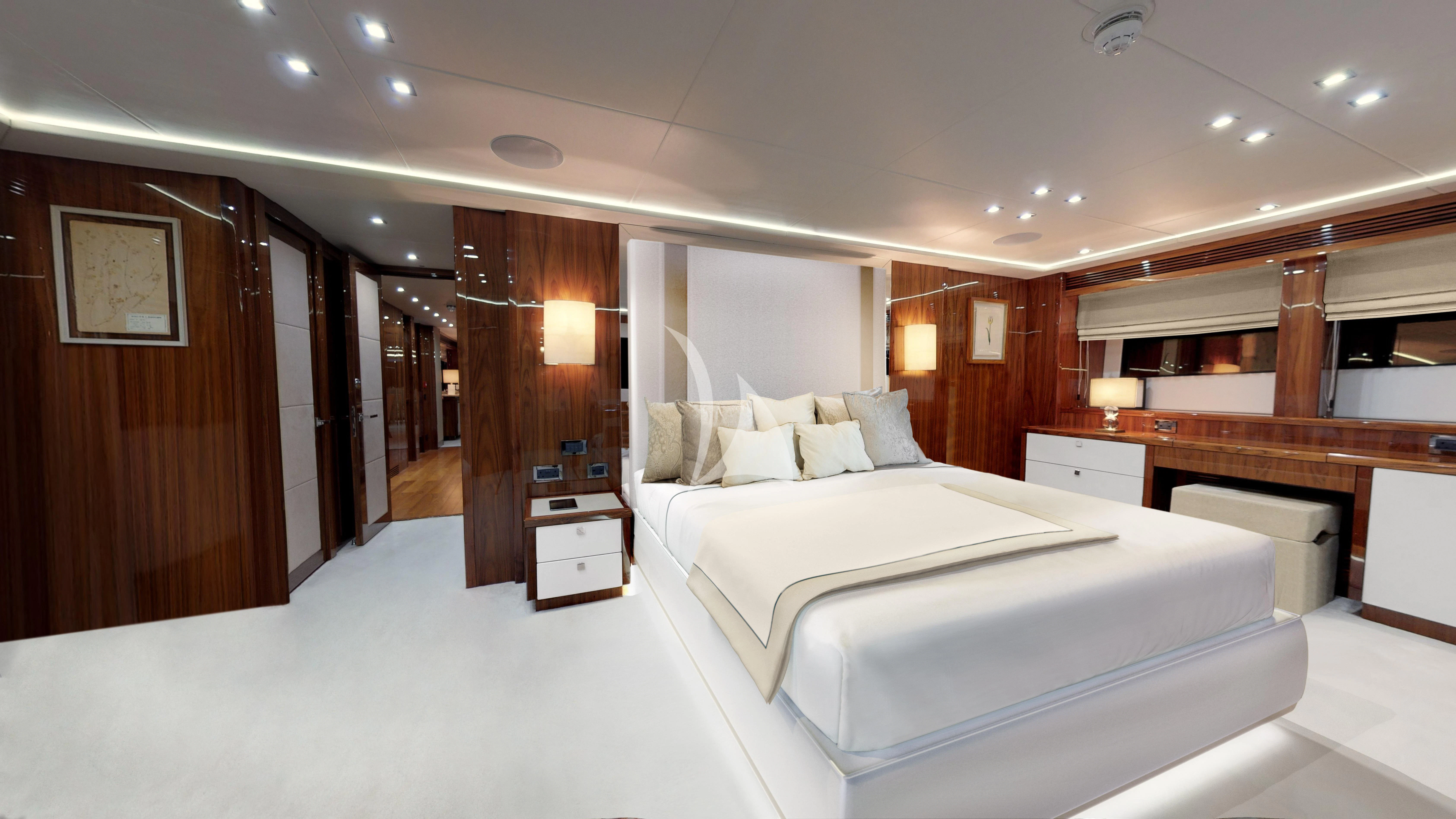 a room with a bed and a desk aboard ANYA Yacht for Sale
