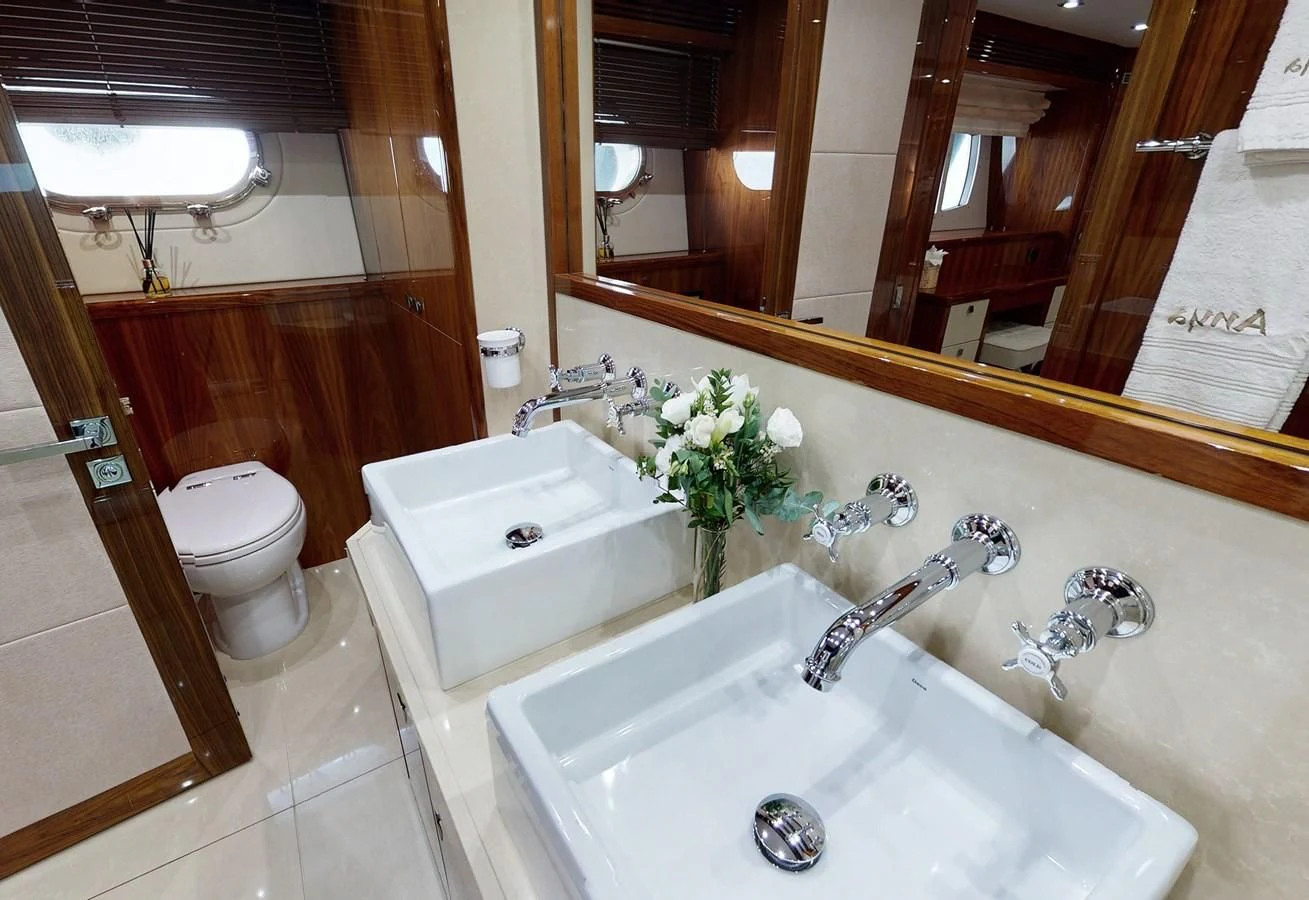 a bathroom with a sink toilet and a bathtub aboard ANYA Yacht for Sale