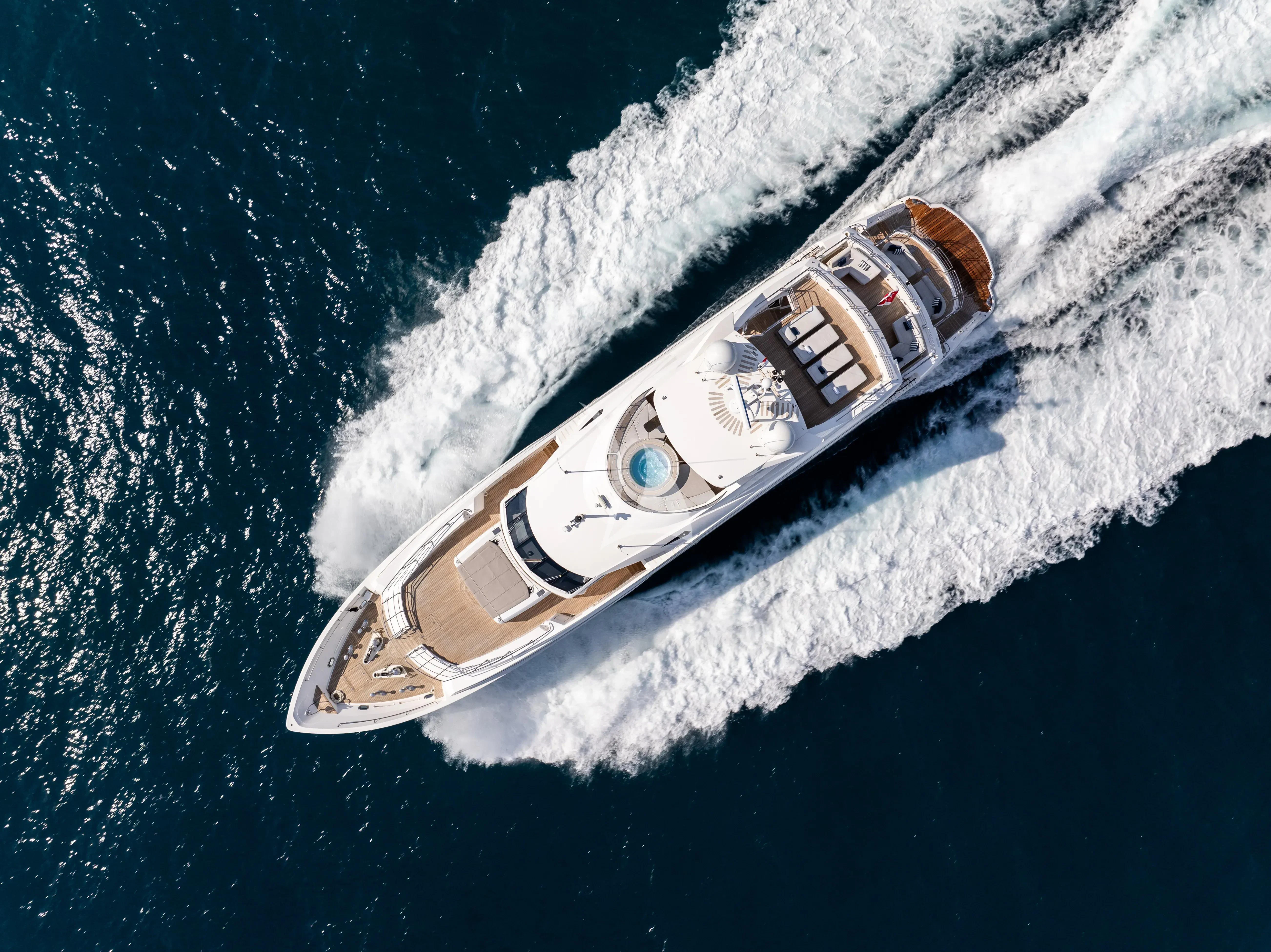 a gold metal watch on a white surface aboard ANYA Yacht for Sale