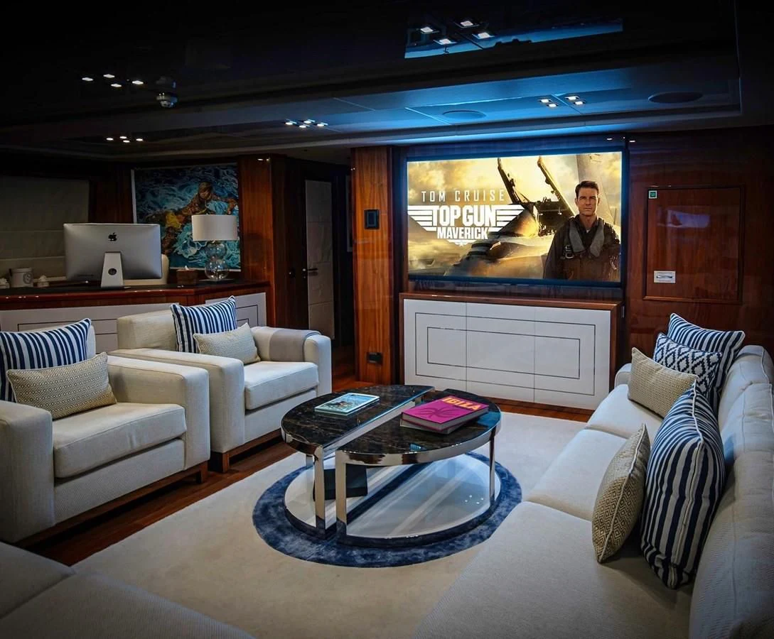 a living room with a large screen aboard ANYA Yacht for Sale