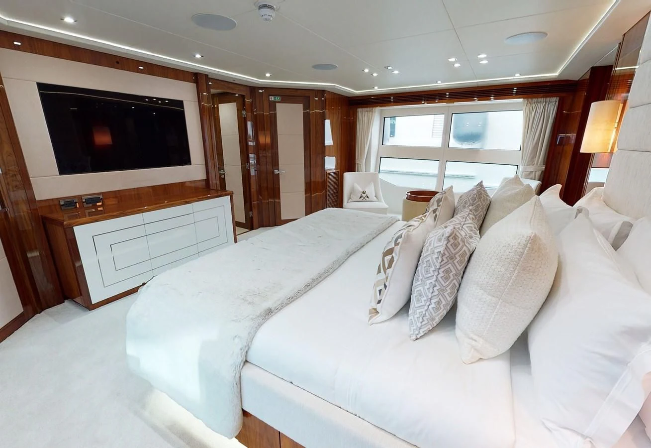 a large bed in a hotel room aboard ANYA Yacht for Sale
