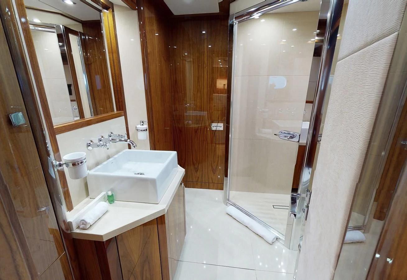 a bathroom with a sink and a shower aboard ANYA Yacht for Sale