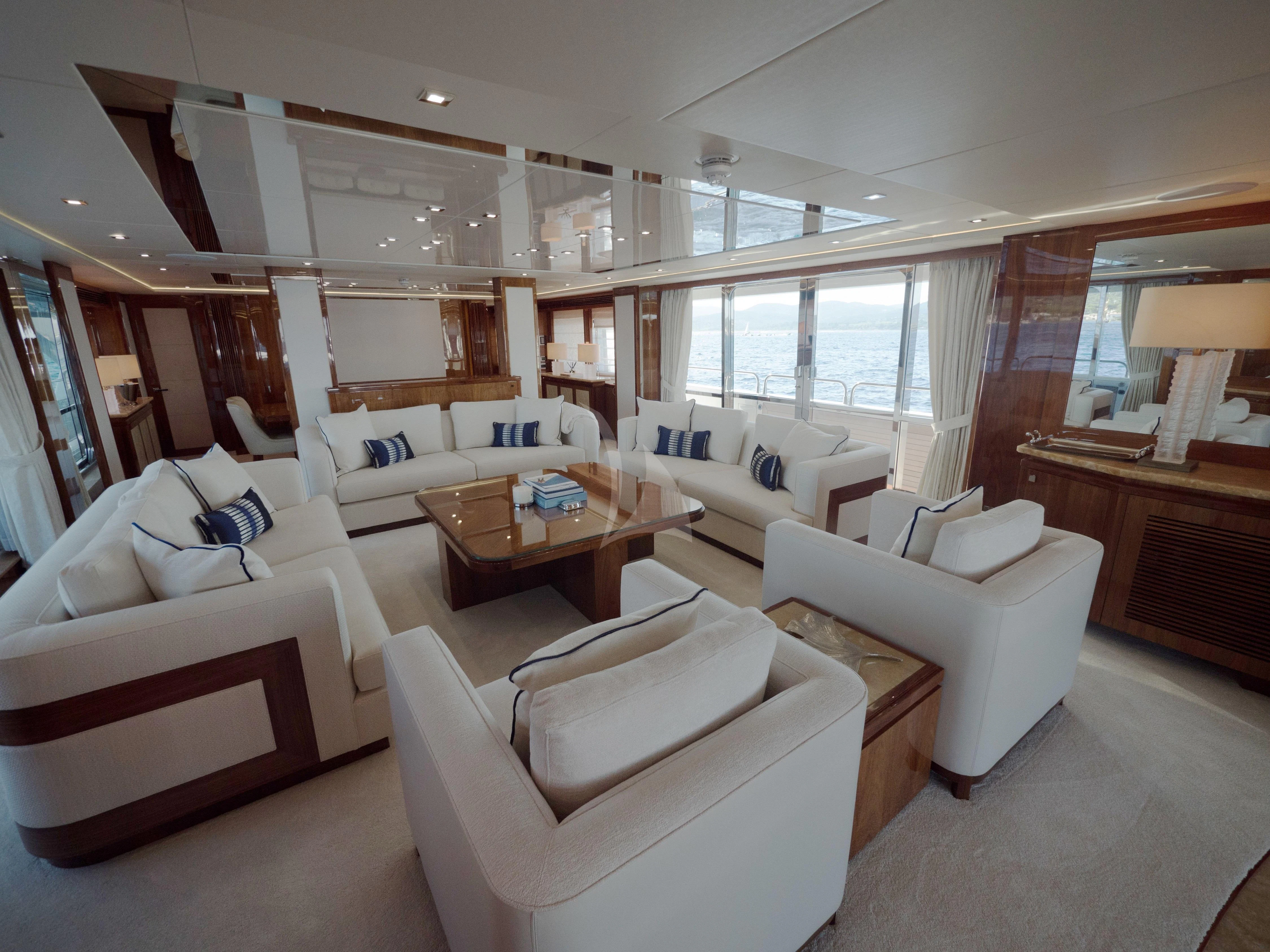 a living room with a couch and a table aboard ANYA Yacht for Sale