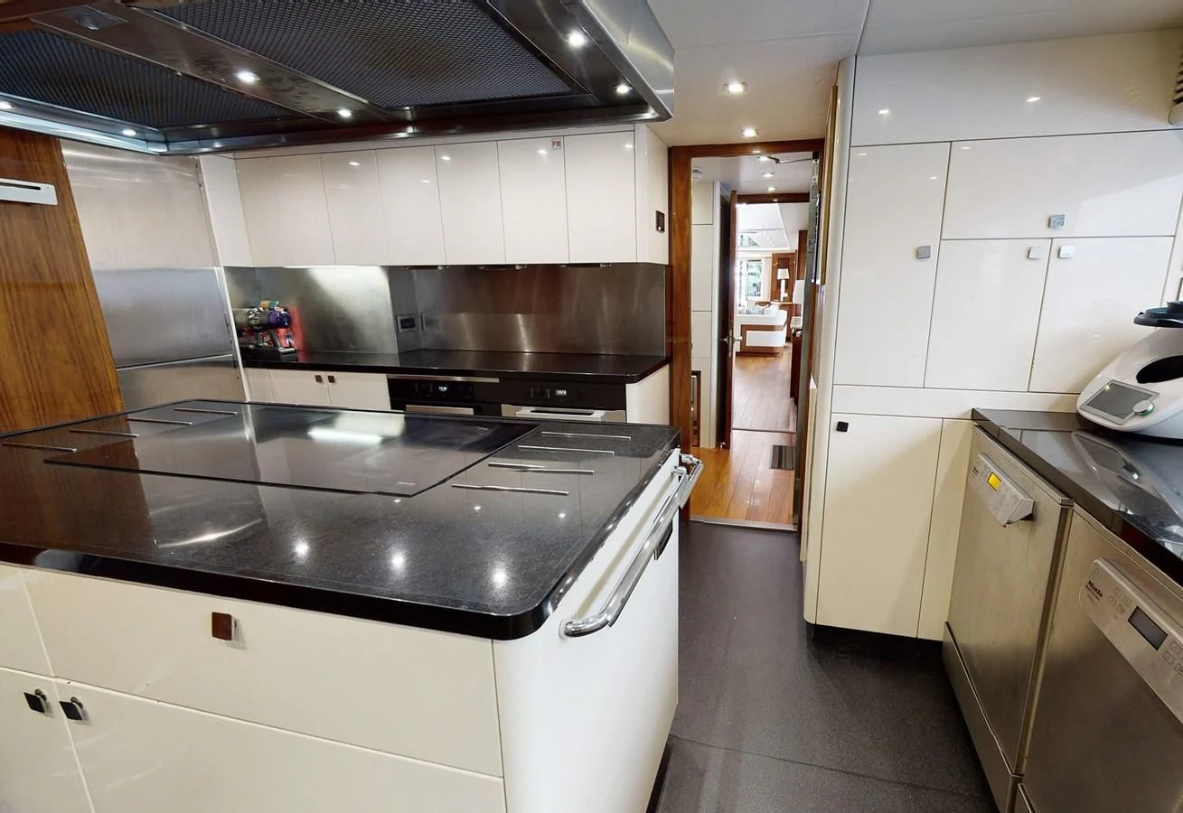 a kitchen with a stove and cabinets aboard ANYA Yacht for Sale