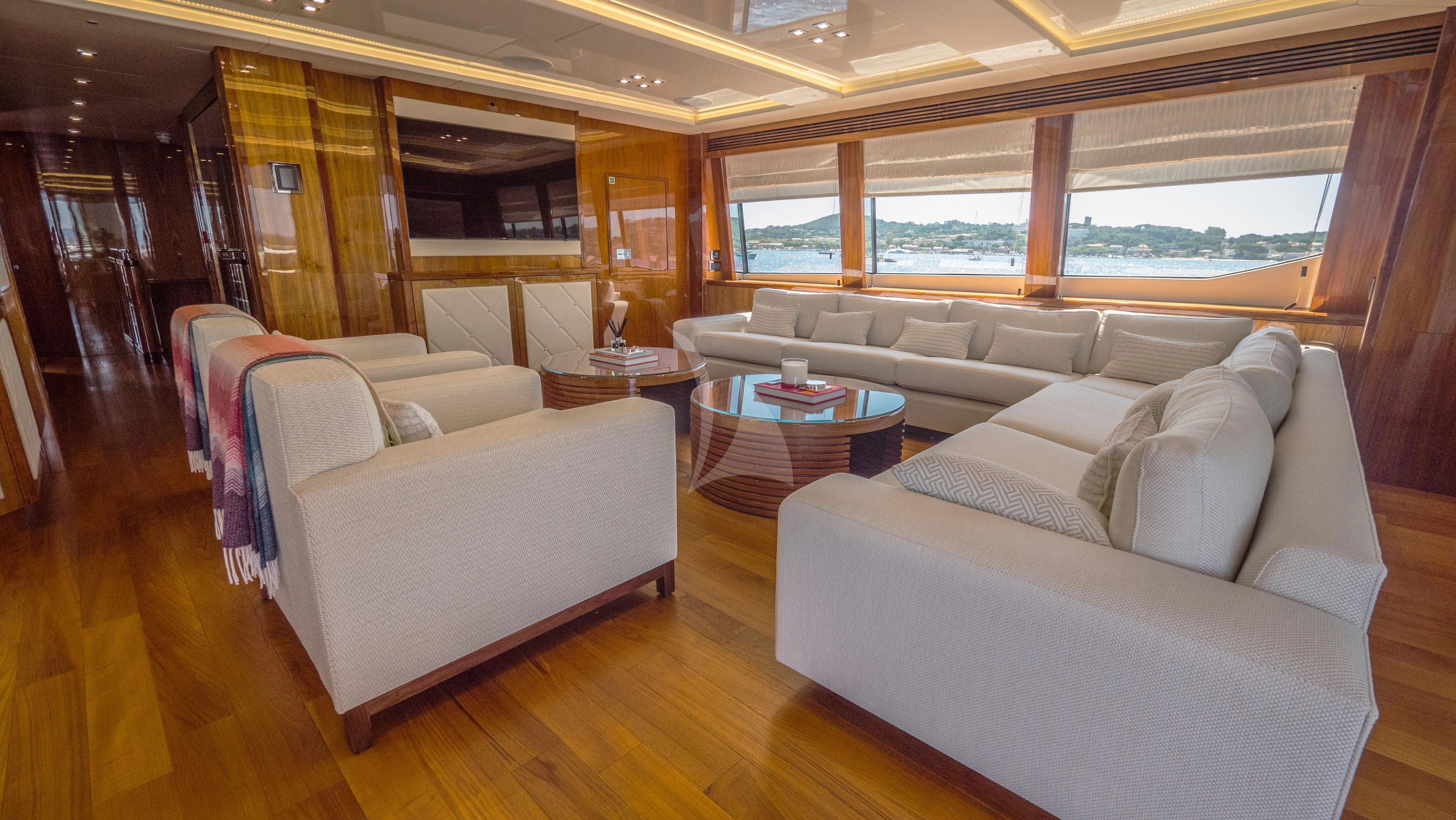 a living room with a couch and a table aboard ANYA Yacht for Sale
