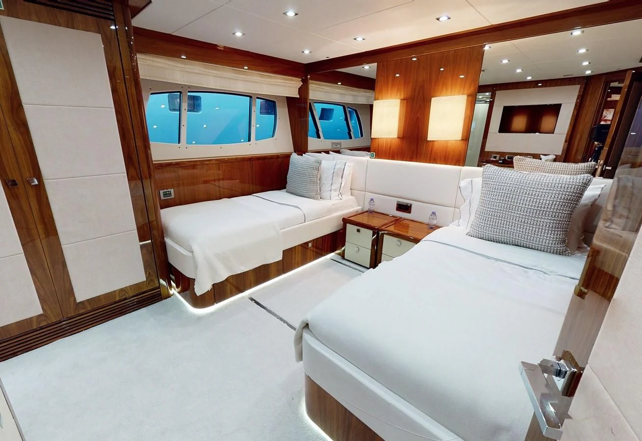 a room with two beds aboard ANYA Yacht for Sale