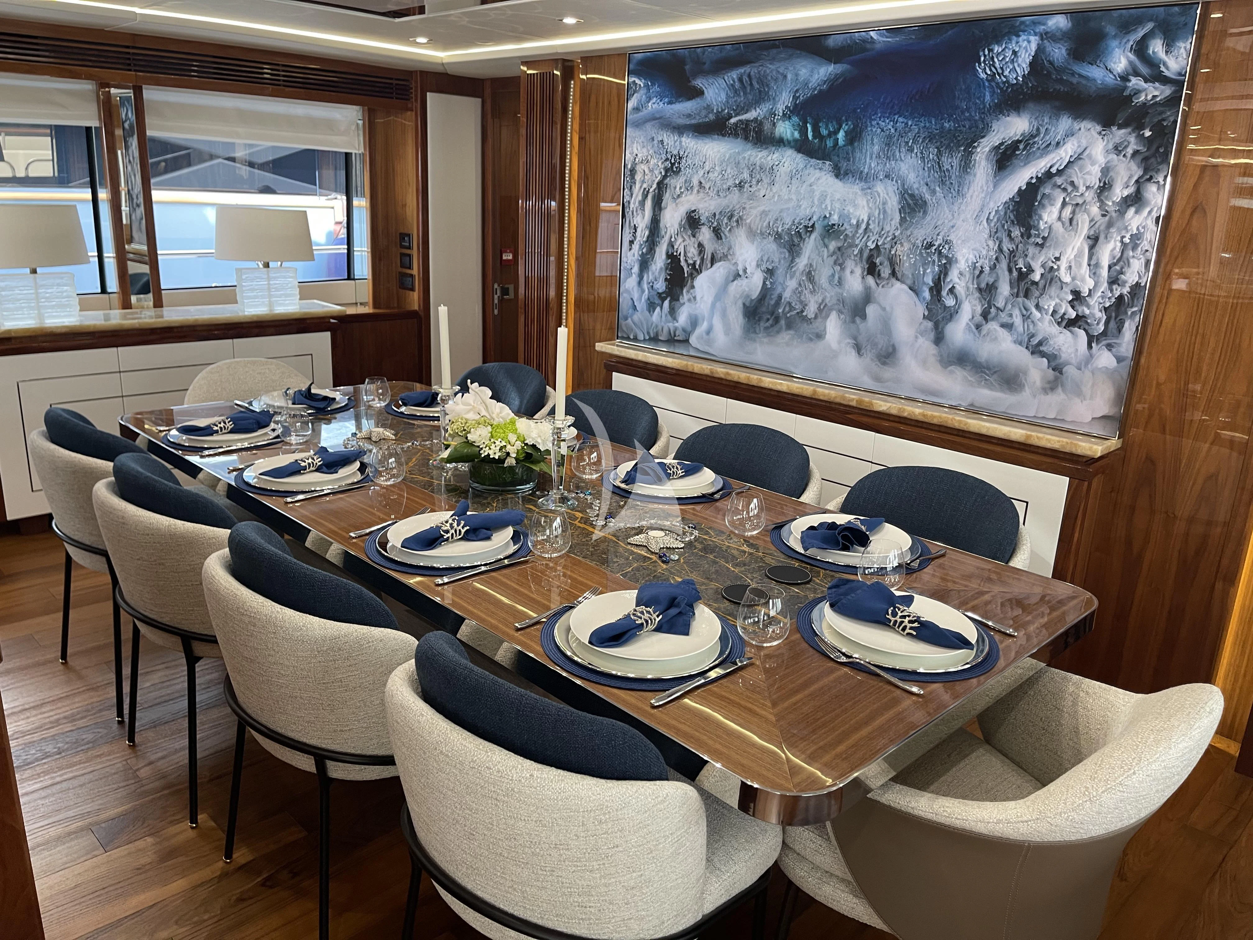 a dining room with a table set aboard ANYA Yacht for Sale