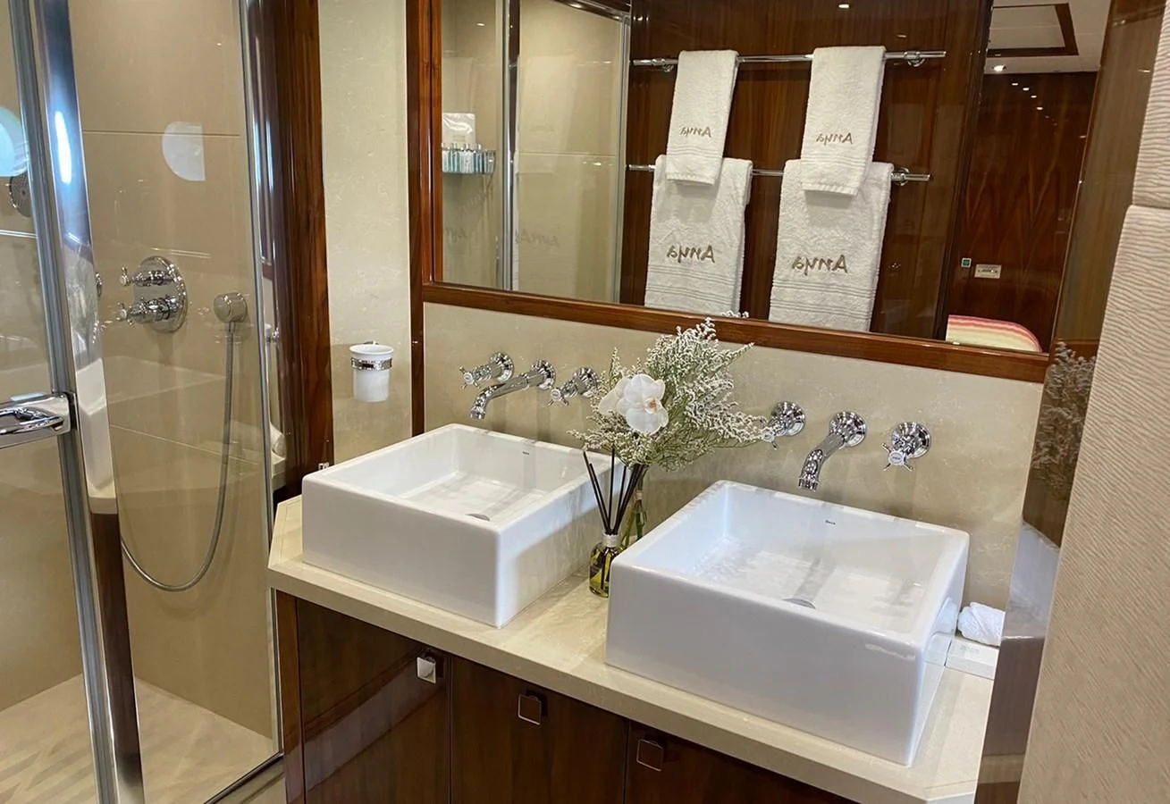 a bathroom with a large mirror aboard ANYA Yacht for Sale