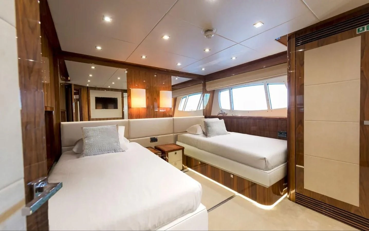 a room with a bed and a mirror aboard ANYA Yacht for Sale