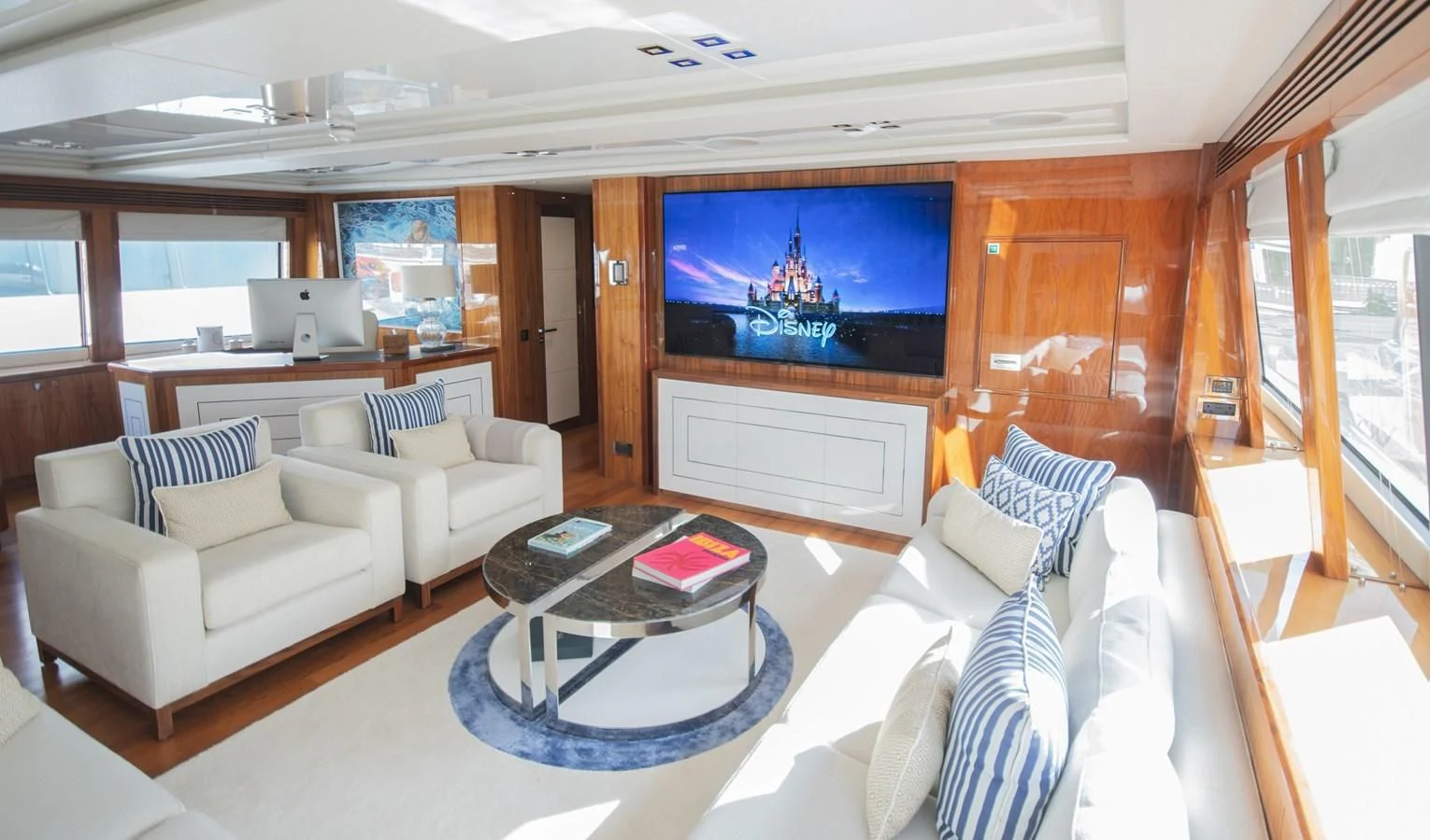 a living room with a large screen aboard ANYA Yacht for Sale