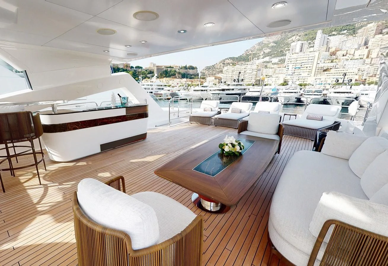 a room with a table chairs and a large window aboard ANYA Yacht for Sale