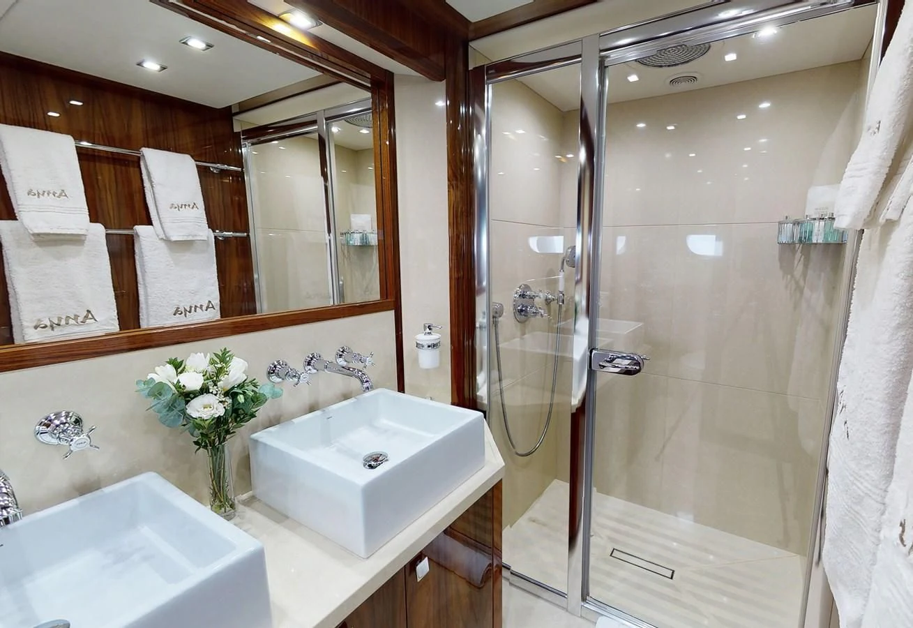 a bathroom with a glass shower aboard ANYA Yacht for Sale
