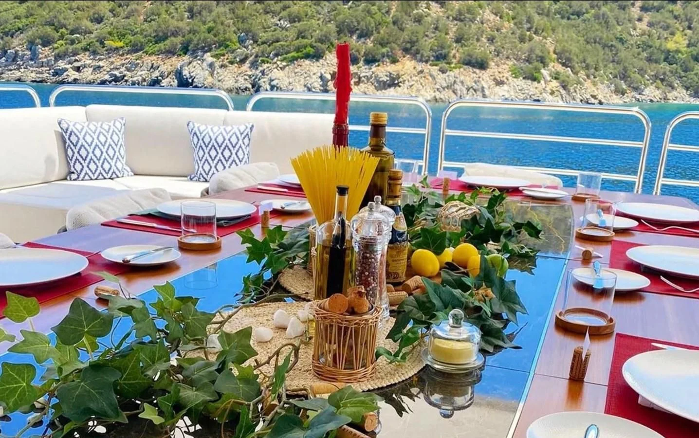 a table set with food and drinks aboard ANYA Yacht for Sale