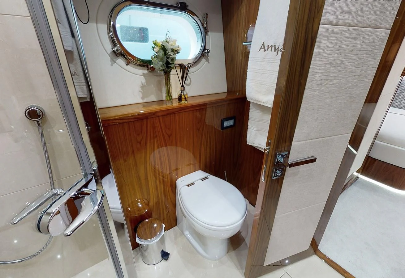 a bathroom with a toilet and a sink aboard ANYA Yacht for Sale
