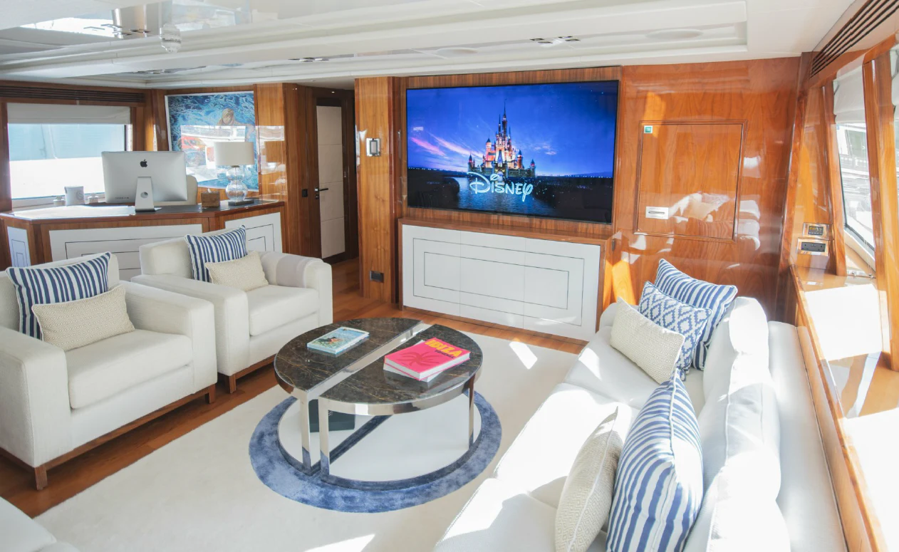 a living room with a large television aboard ANYA Yacht for Sale