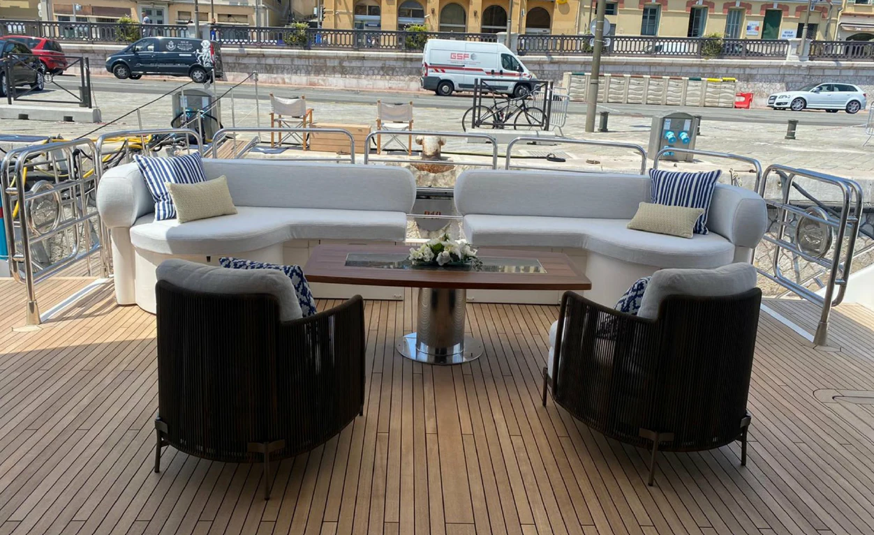 a table and chairs on a deck aboard ANYA Yacht for Sale