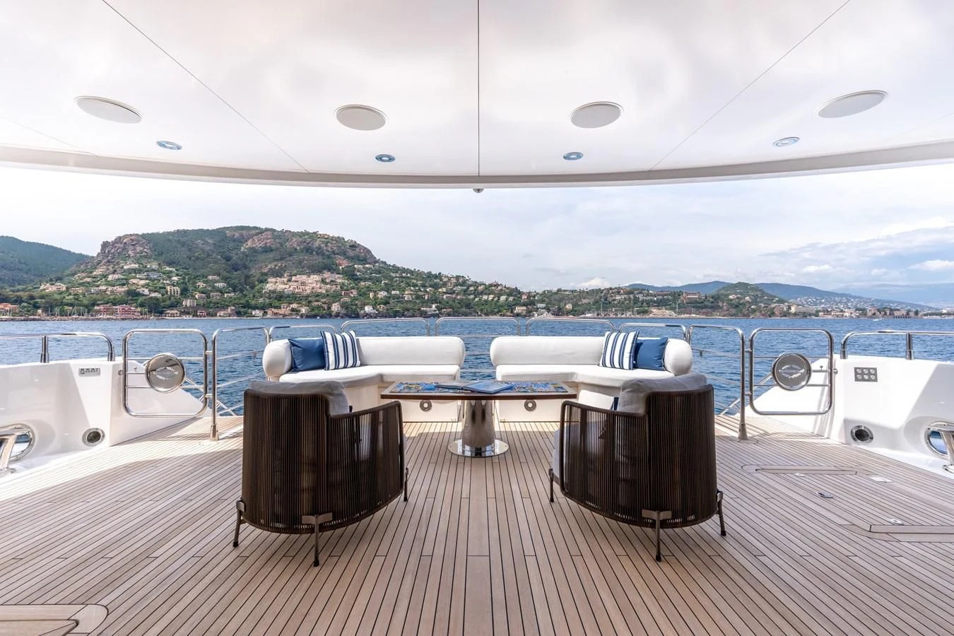 a deck with a table and chairs on it aboard ANYA Yacht for Sale