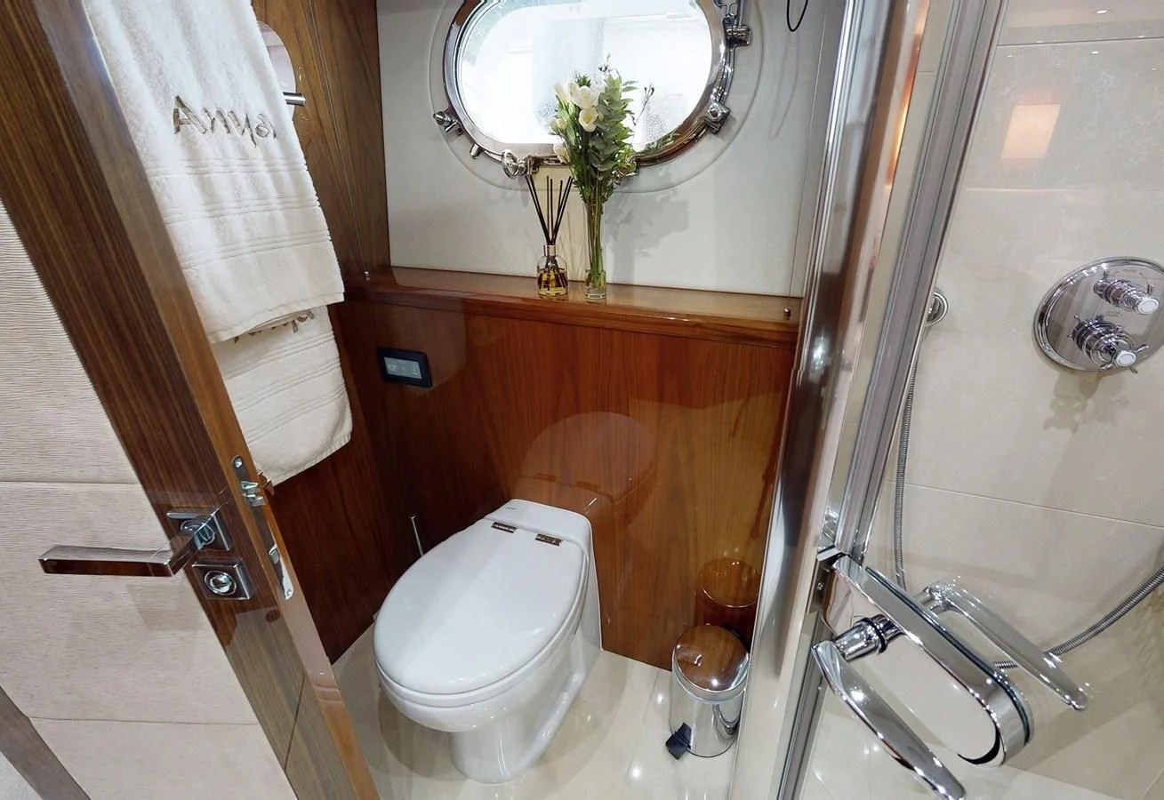a bathroom with a toilet and a sink aboard ANYA Yacht for Sale