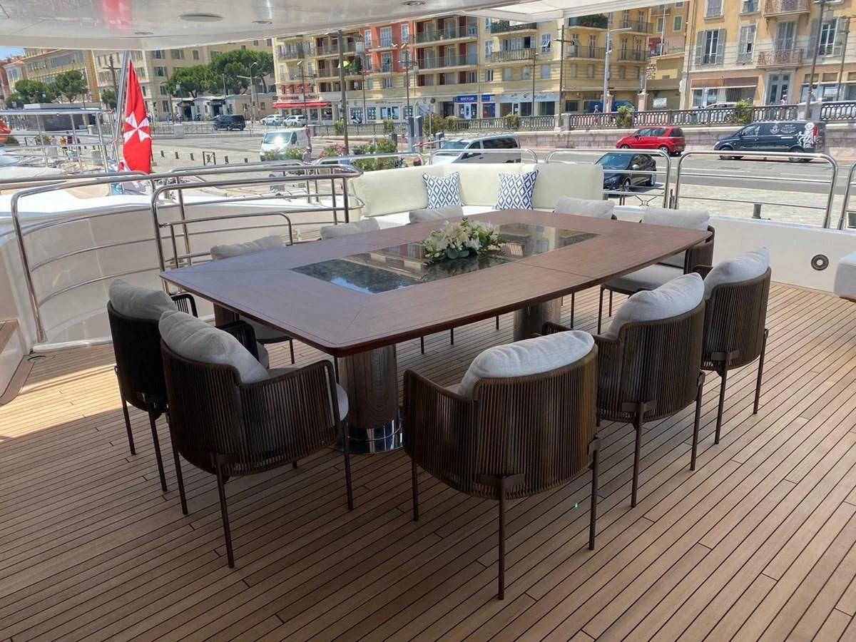 a table with chairs around it aboard ANYA Yacht for Sale