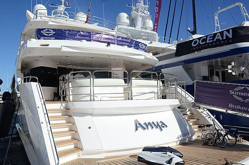 a large cruise ship docked aboard ANYA Yacht for Sale