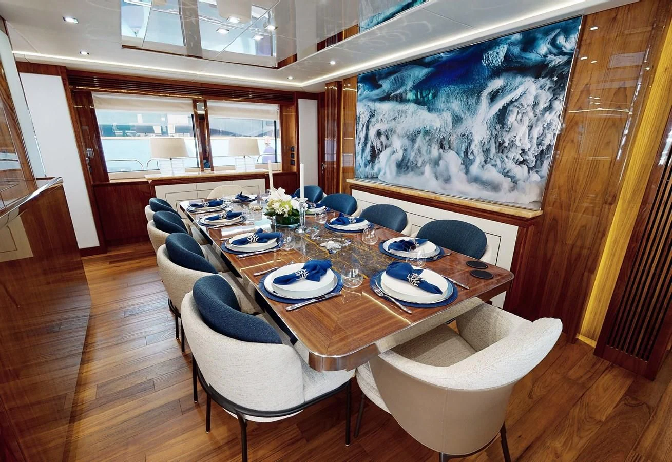a dining room with a table and chairs aboard ANYA Yacht for Sale