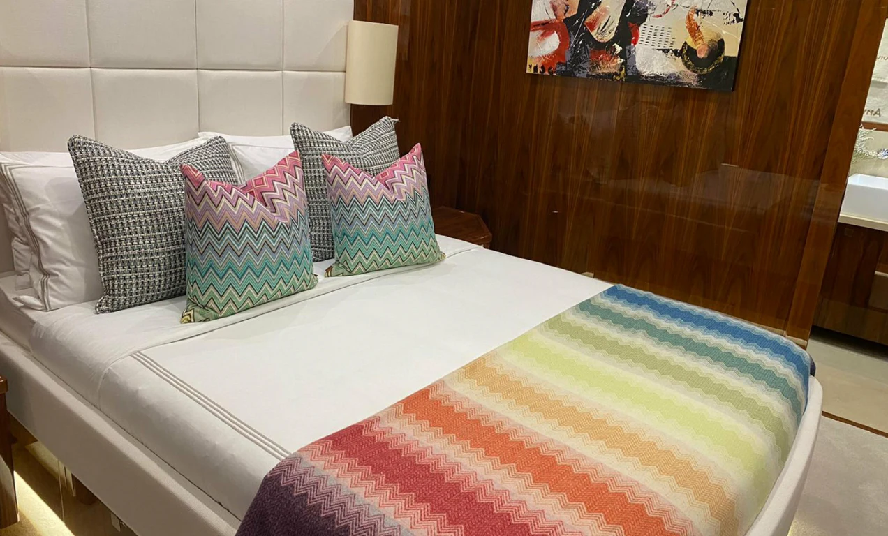 a bed with pillows aboard ANYA Yacht for Sale