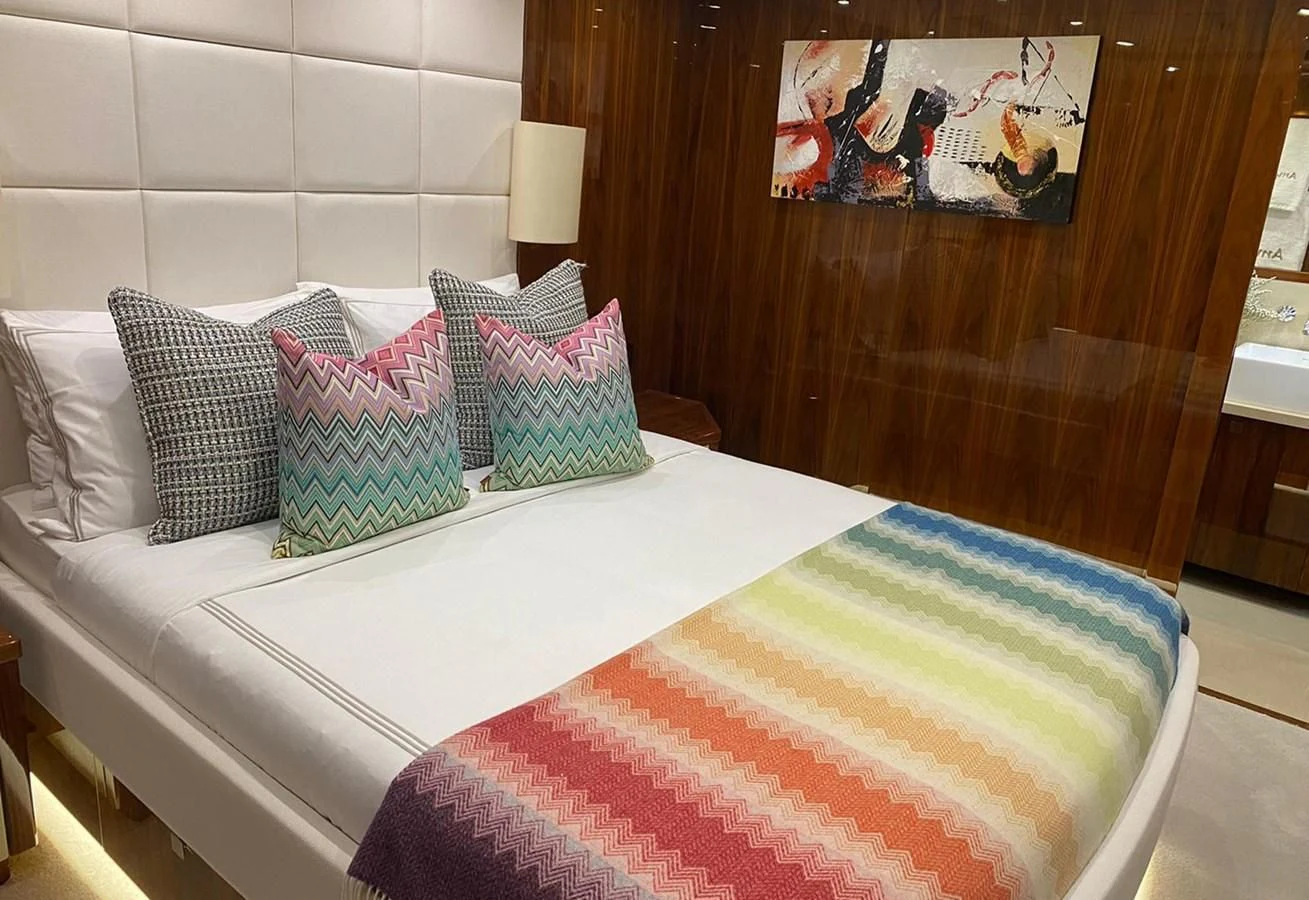 a bed with pillows aboard ANYA Yacht for Sale