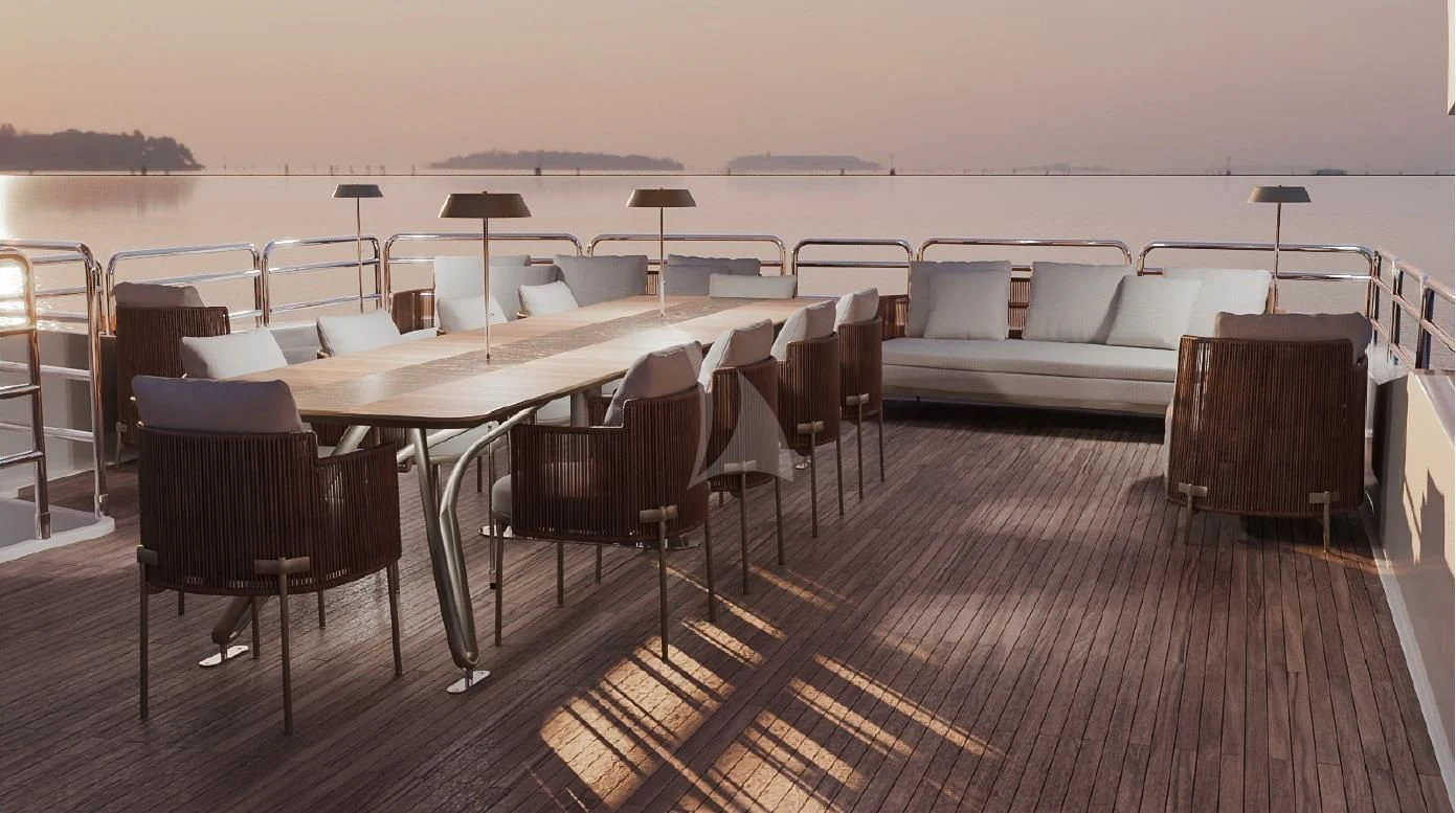 a large room with a couch and a table and chairs aboard ANYA Yacht for Sale
