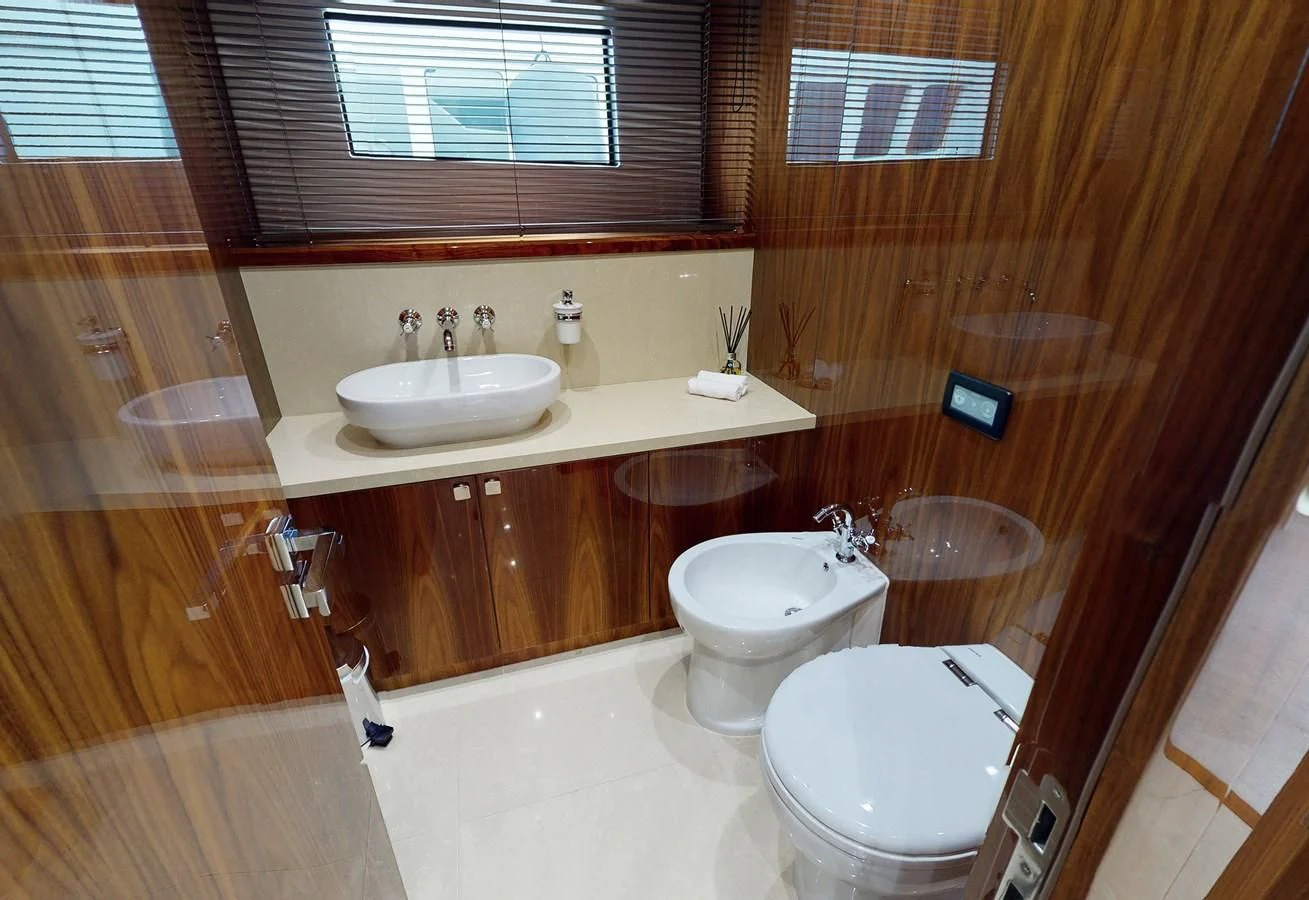 a bathroom with a toilet and sink aboard ANYA Yacht for Sale