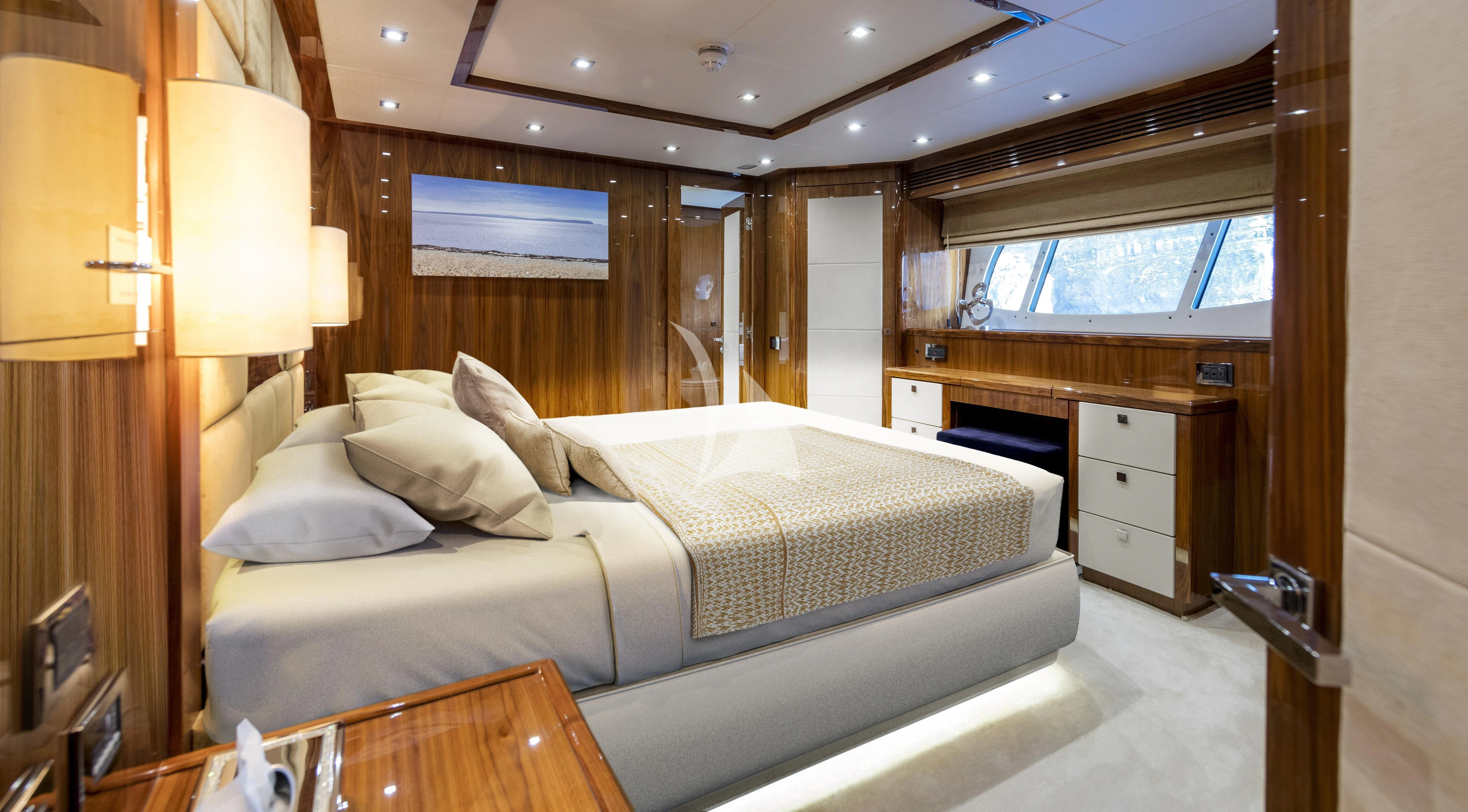 a room with a bed and a window aboard ANYA Yacht for Sale