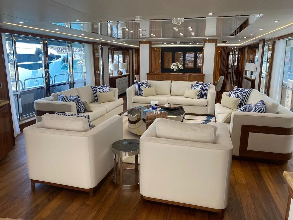 a living room with white furniture aboard ANYA Yacht for Sale