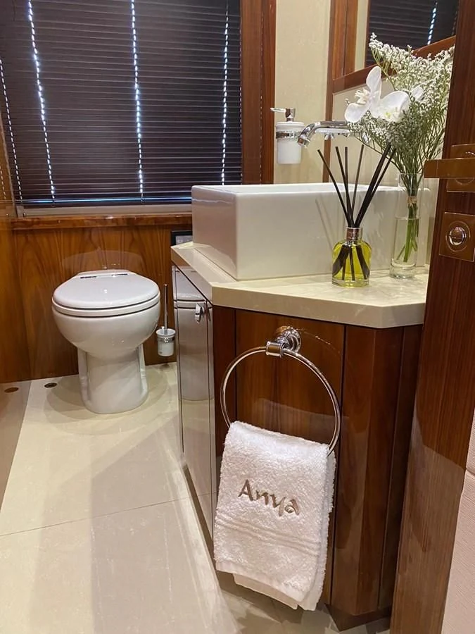 a bathroom with a toilet and sink aboard ANYA Yacht for Sale