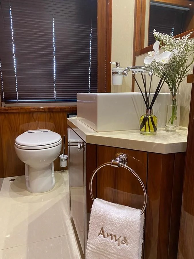 a bathroom with a toilet and a sink aboard ANYA Yacht for Sale