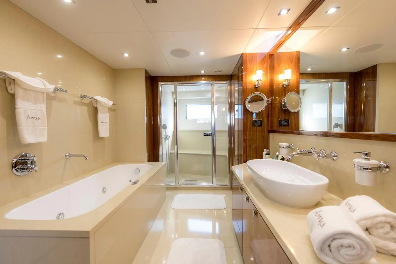 a bathroom with a bathtub sink and a sink aboard ANYA Yacht for Sale