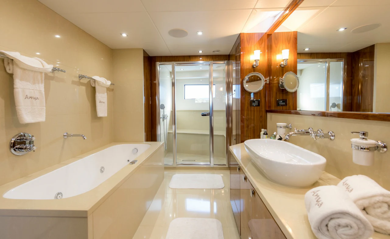 a bathroom with a bathtub sink and a shower aboard ANYA Yacht for Sale