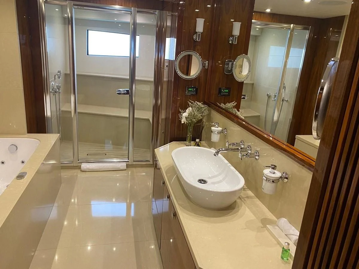 a bathroom with a sink and a shower aboard ANYA Yacht for Sale