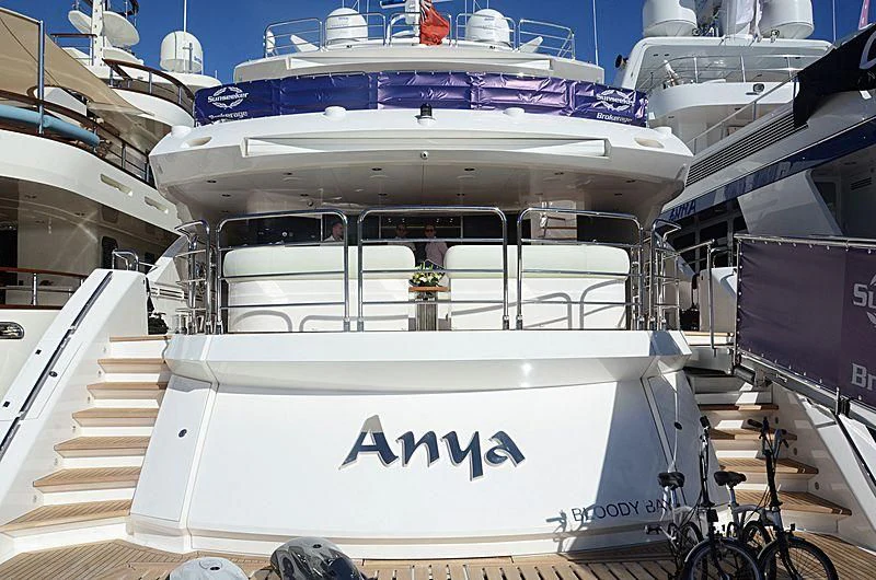 a white boat with a sign on it aboard ANYA Yacht for Sale