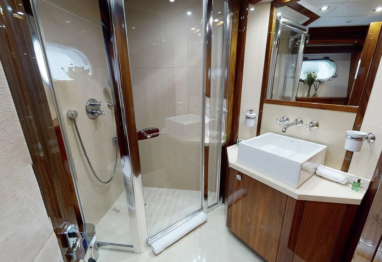 a bathroom with a stand up shower aboard ANYA Yacht for Sale