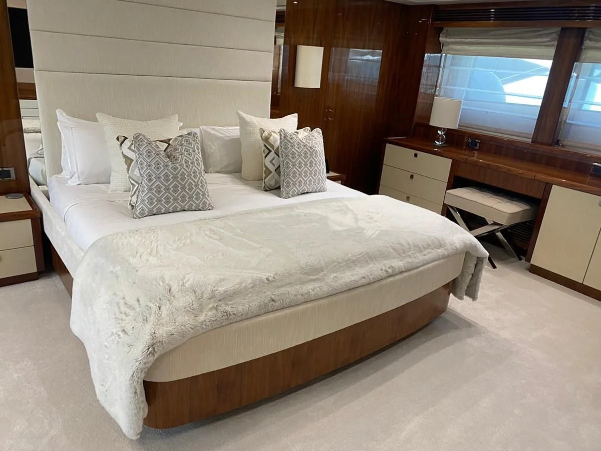 a bed with pillows on it aboard ANYA Yacht for Sale