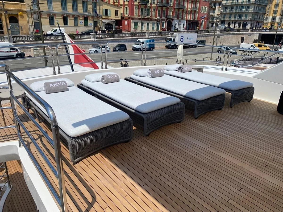 a large piano on a wooden floor aboard ANYA Yacht for Sale