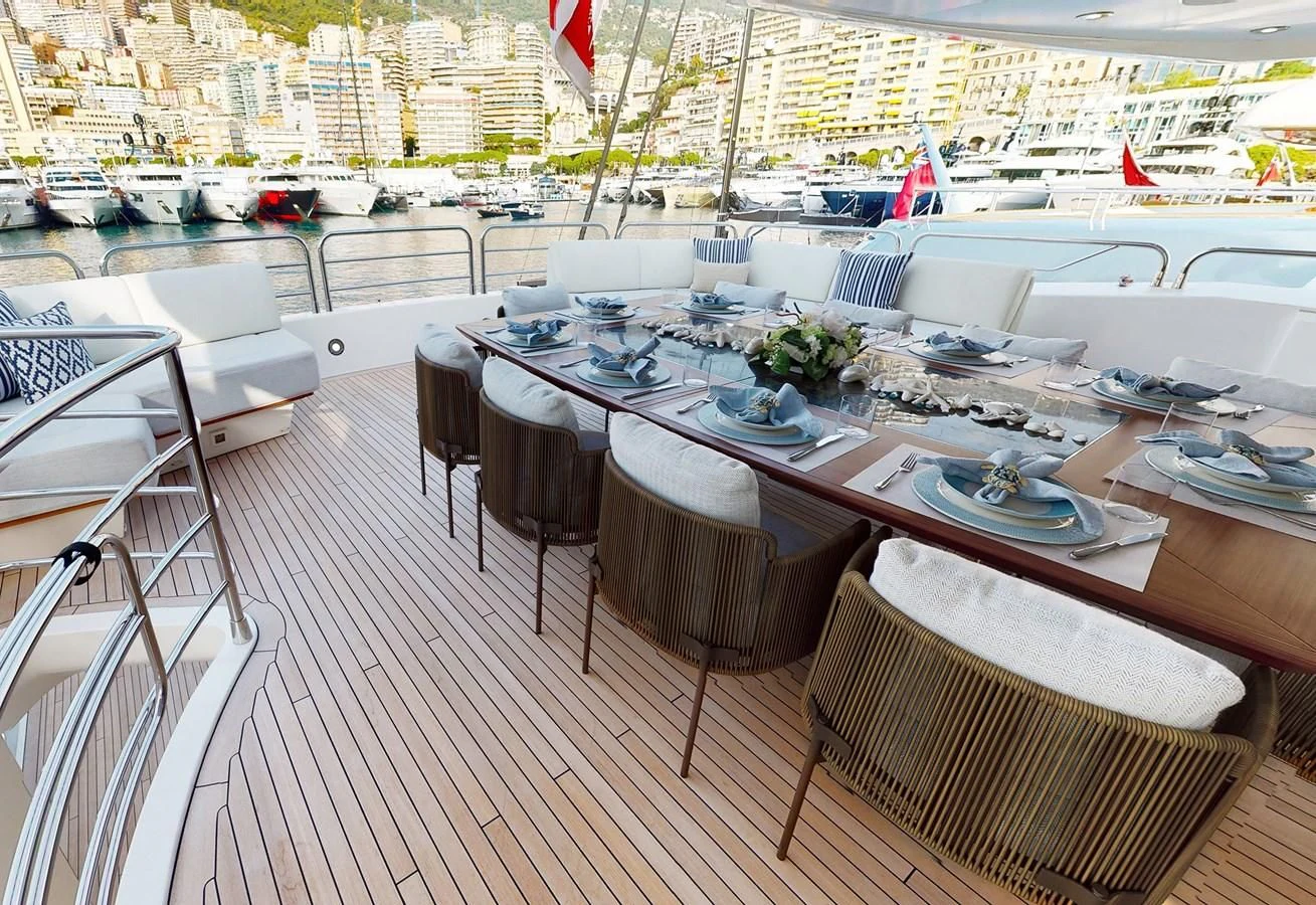 a table with chairs on it aboard ANYA Yacht for Sale