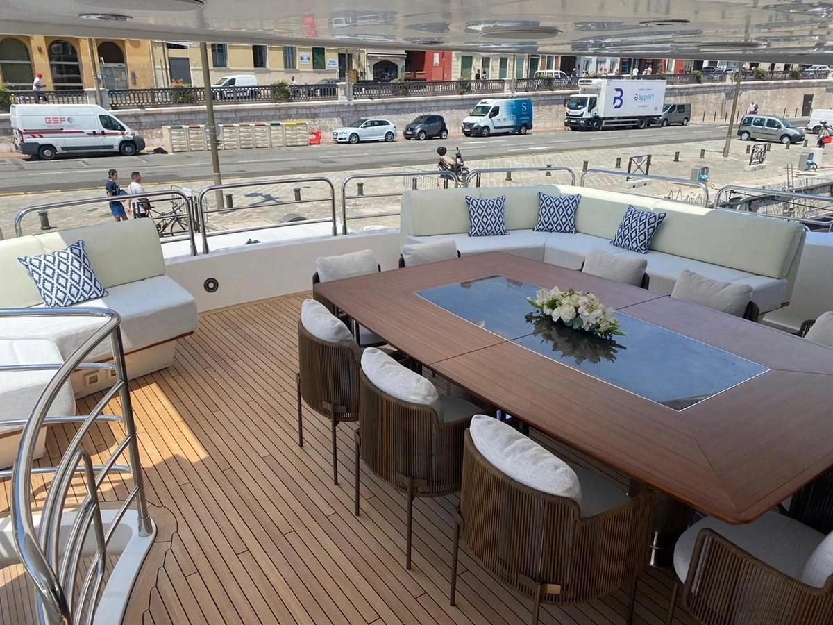 a table with chairs on it aboard ANYA Yacht for Sale