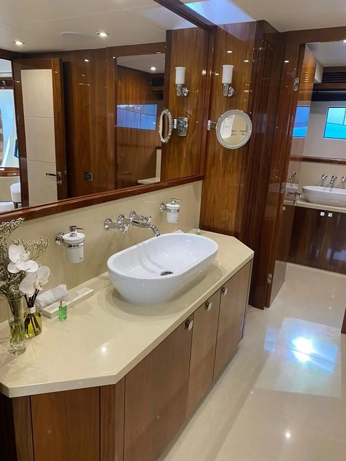 a bathroom with a large mirror aboard ANYA Yacht for Sale