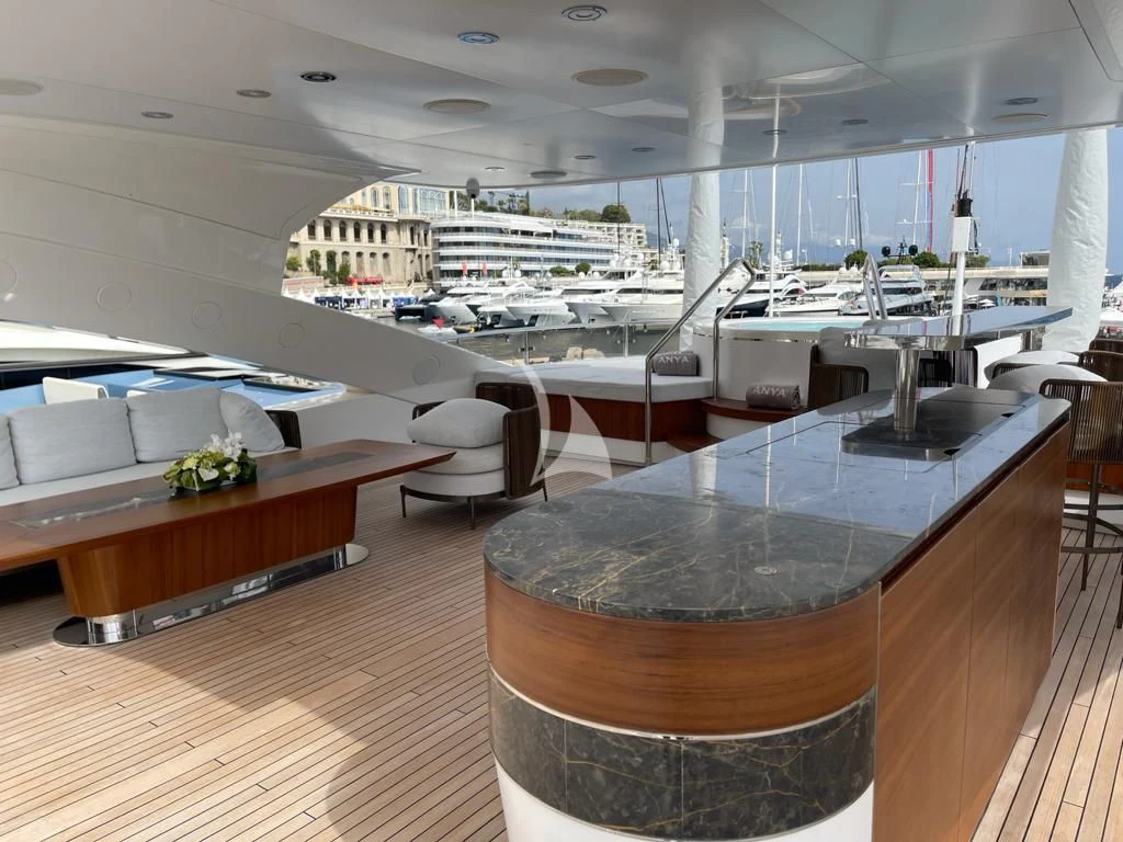a large room with a table and chairs aboard ANYA Yacht for Sale