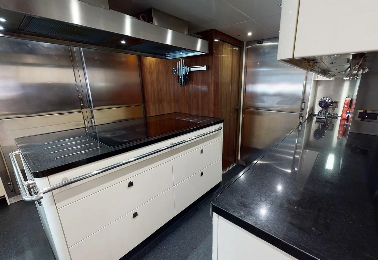 a kitchen with stainless steel appliances aboard ANYA Yacht for Sale