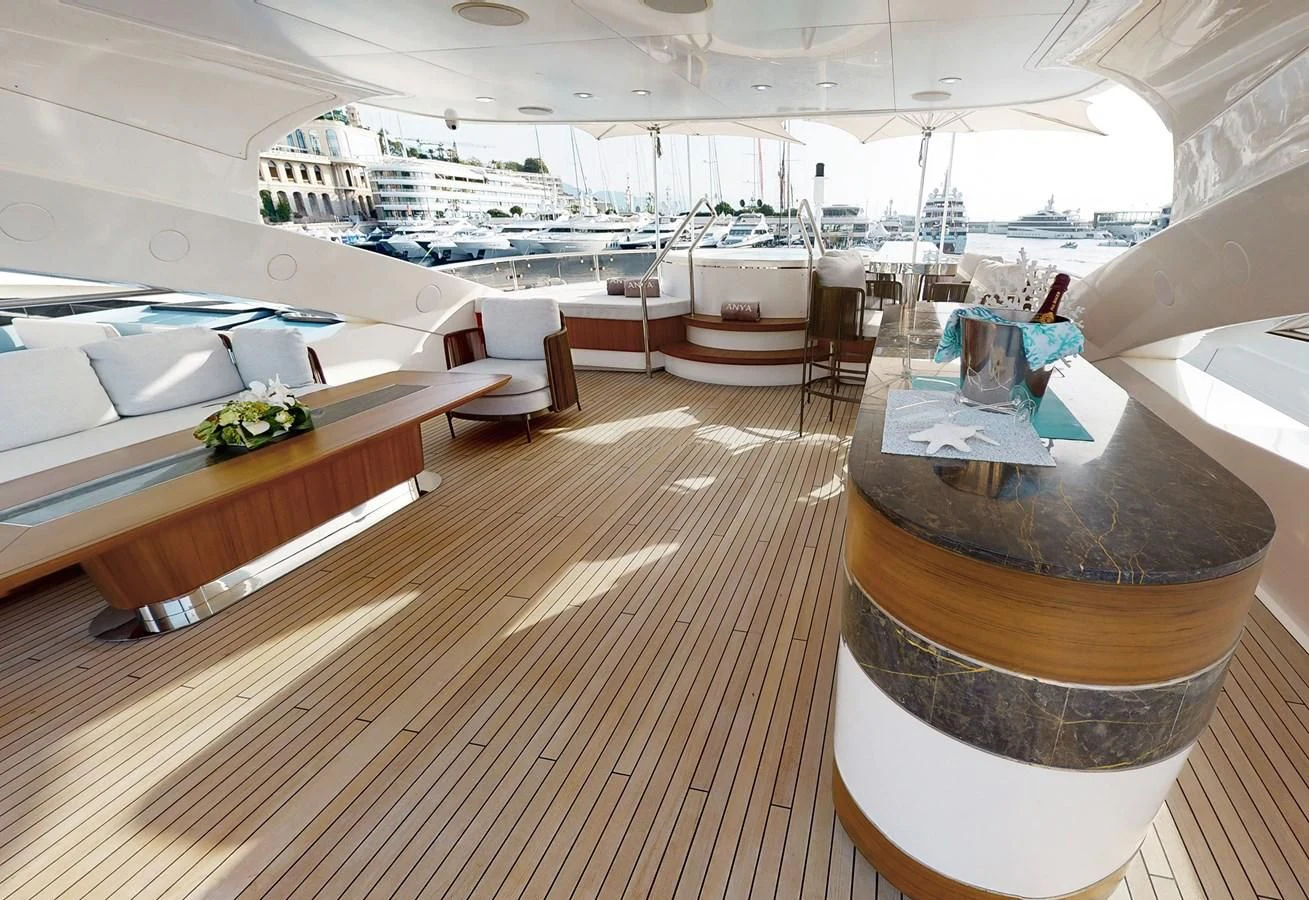 a room with a table and chairs aboard ANYA Yacht for Sale