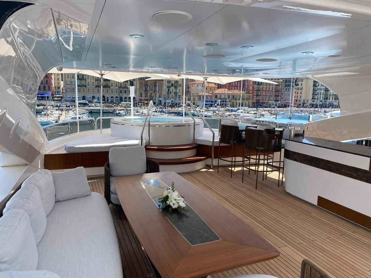 a room with a view of a city and a large pool aboard ANYA Yacht for Sale