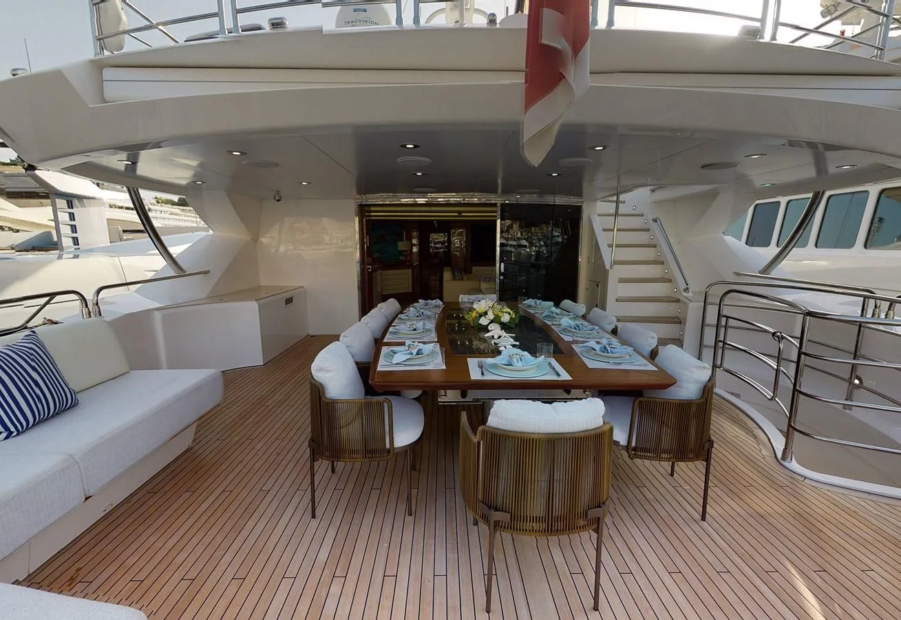 a boat with a table and chairs aboard ANYA Yacht for Sale
